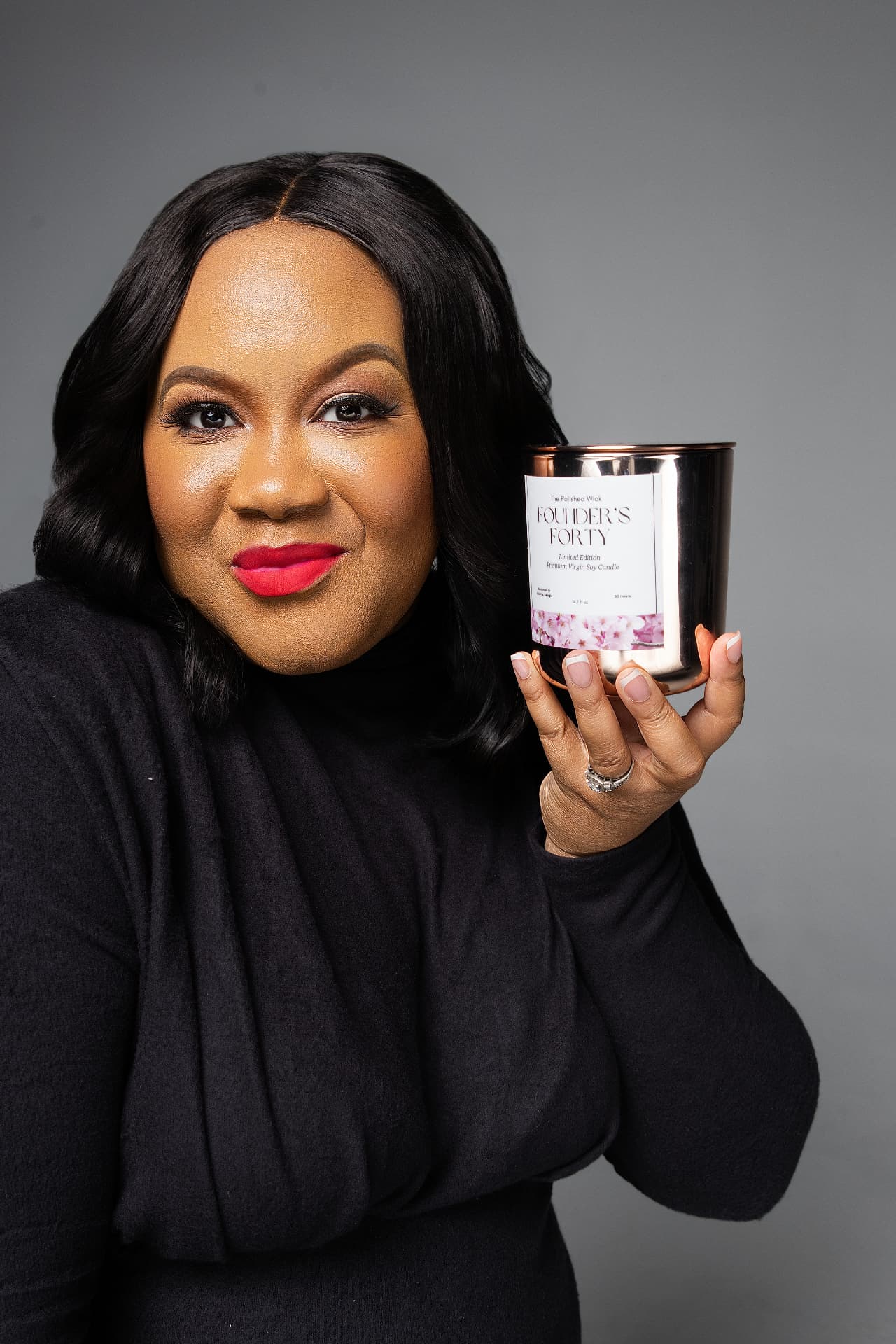 Founder presenting the Founder's Forty premium soy candle against a gray backdrop
